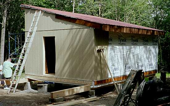 roof rafters framed at the 3 in 12 pitch on the 16x24 cabin