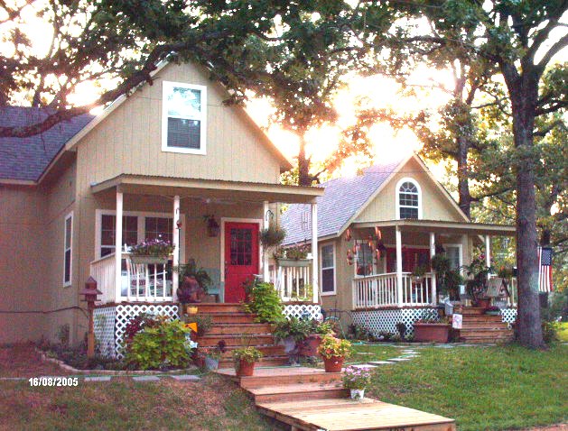 both cottages seen from the front, with the larger Victoria cottage stepping forward