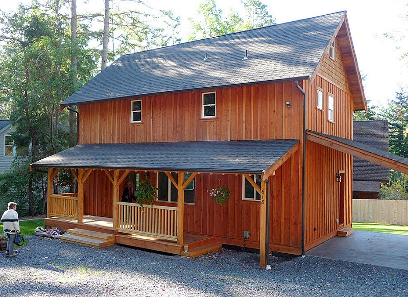 the cottage from the carport side, with the porch roof running the length of the house