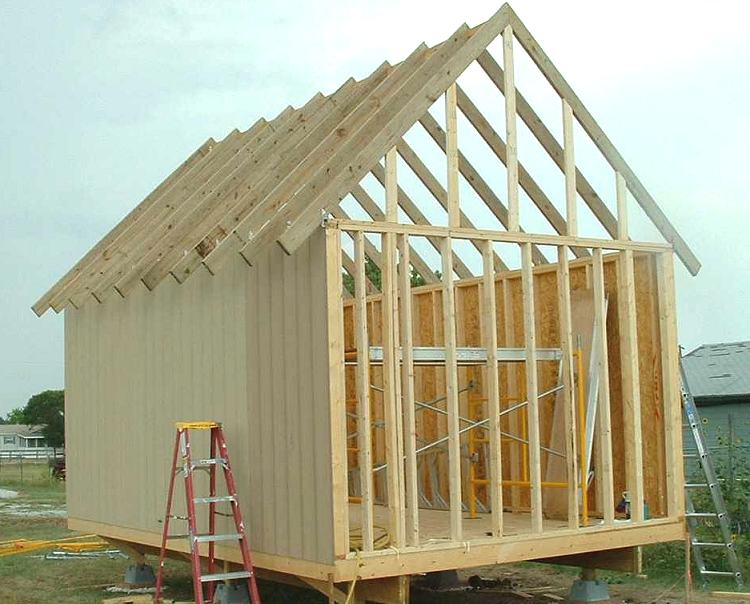 wall and roof framing with the center ridge board on a 12x18 cabin