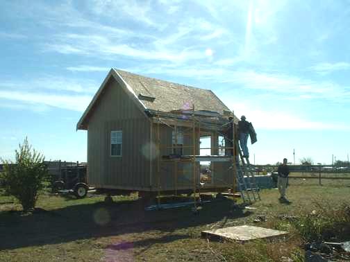 completed exterior of the 12x18 owner built cabin and storage shed