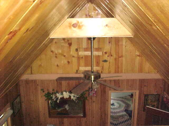 main floor bedroom seen from the loft above