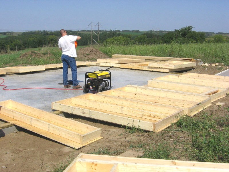 wall panels laid out flat on the finished slab, ready to be stood up
