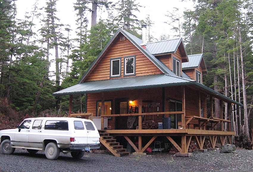 Alaska cabin, owner built, deck finished with furniture