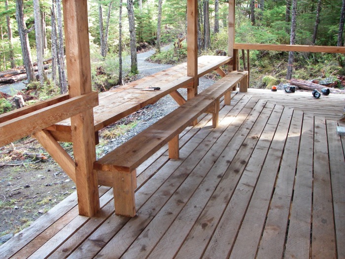 bench seat and table built into the wraparound porch