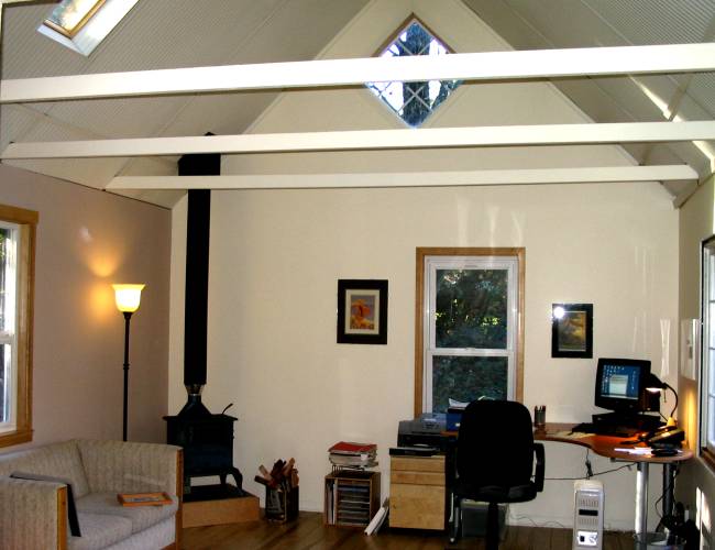 open ceiling with rafter ties inside the backyard studio office