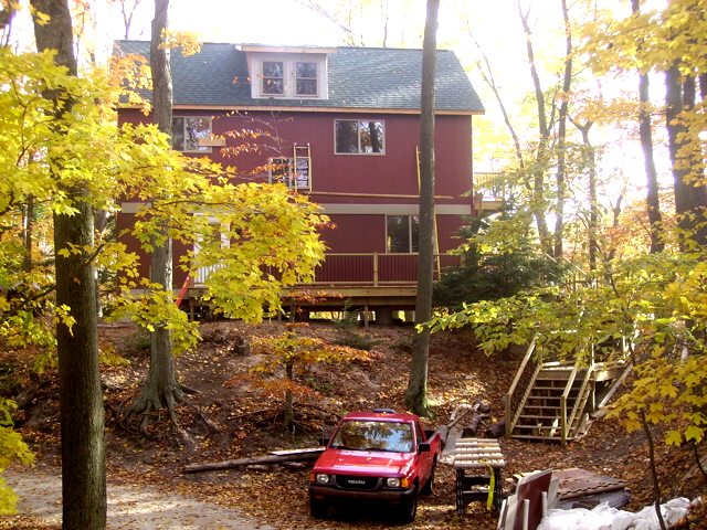 stairs leading up to the wrap around deck of the Universal Cottage