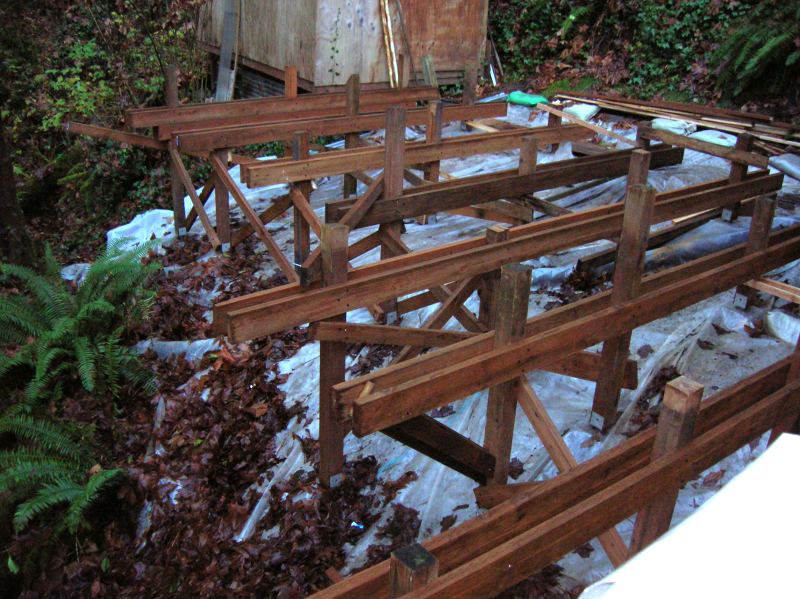 posts, braced bents and main beams framing the deck over the slope