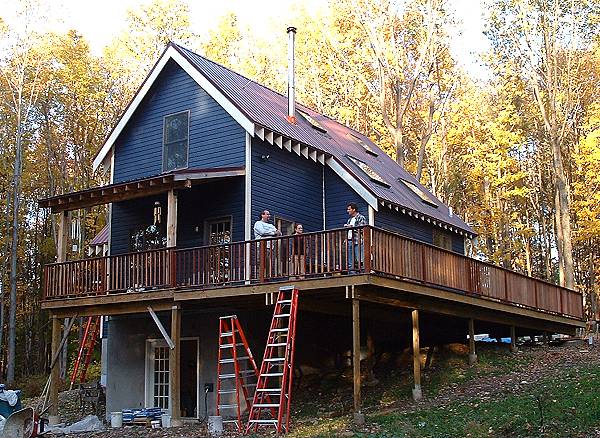 the deck carried on posts across the downhill side of the house, over the walkout basement
