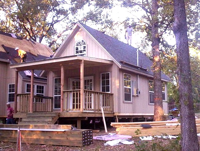 front porch of the Builders cottage with its railings up and the roof going on