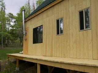 the cabin and its wrap around walkway in June 2002