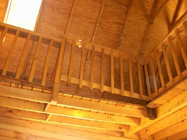catwalk built between the two lofts of the 14x24 cabin