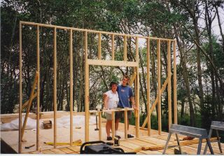the first framed wall standing on the cabin floor