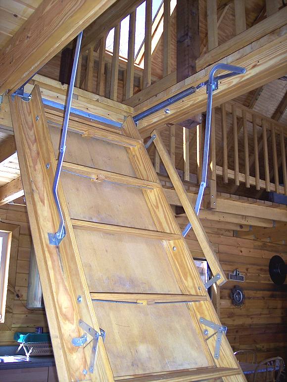 pull down loft ladder being extended to the floor