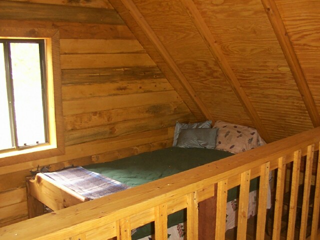 small sleeping loft at the far end of the catwalk